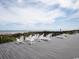 Relaxing beach deck with ocean views and white rocking chairs at Tbd Old Cypress Circle, Pawleys Island, SC 29585