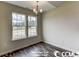 Bright dining room with hardwood floors and chandelier at 2819 Biscane Ct., Conway, SC 29527