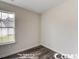Simple bedroom with wood-look floors and a window at 2819 Biscane Ct., Conway, SC 29527