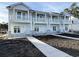 Two story townhouses with gray siding and stone accents at 821 Maxine Ct. # 2D, Myrtle Beach, SC 29577