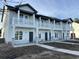 Three-unit townhome building, featuring gray siding, stone accents, and white railings at 861 Maxine Ct. # 4A, Myrtle Beach, SC 29577