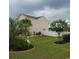 Landscaped backyard with palm trees and garden at 219 Oak Leaf Dr., Longs, SC 29568