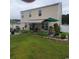 Large backyard with patio and awning, perfect for outdoor entertaining at 219 Oak Leaf Dr., Longs, SC 29568