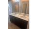 Double vanity bathroom with modern fixtures at 219 Oak Leaf Dr., Longs, SC 29568