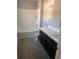 Clean bathroom with bathtub, shower, and dark vanity at 219 Oak Leaf Dr., Longs, SC 29568