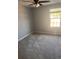 Bright bedroom with grey carpet and ceiling fan at 219 Oak Leaf Dr., Longs, SC 29568