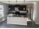 Modern kitchen with dark cabinets and stainless steel appliances at 219 Oak Leaf Dr., Longs, SC 29568