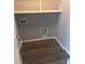 Laundry closet with shelving and hookups at 219 Oak Leaf Dr., Longs, SC 29568