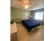 Cozy bedroom with a double bed, ceiling fan, and tile floor at 1880 Colony Dr. # 12-F, Surfside Beach, SC 29575