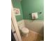 Half bathroom with toilet and wood cabinet at 1880 Colony Dr. # 12-F, Surfside Beach, SC 29575