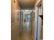 Long hallway with tile floor and access to other rooms at 1880 Colony Dr. # 12-F, Surfside Beach, SC 29575