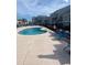 Community pool with lounge chairs and a surrounding fence at 1880 Colony Dr. # 12-F, Surfside Beach, SC 29575