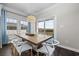 Dining room with wooden table and white chairs, overlooking water views at 416 27Th Ave. N, North Myrtle Beach, SC 29582