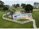 Community pool with lounge chairs, umbrellas, and a lifeguard station at 4843 Luster Leaf Circle # 102, Myrtle Beach, SC 29577