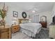 King bed, nightstands, and dresser in a well-lit bedroom at 603 S Ocean Blvd. # 1011, North Myrtle Beach, SC 29582