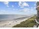 Expansive ocean and beach view from a balcony at 603 S Ocean Blvd. # 1011, North Myrtle Beach, SC 29582