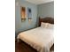 Simple bedroom with a double bed and artwork at 2600 S Ocean Blvd. # 221, Myrtle Beach, SC 29577