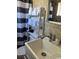 Bathroom with a pedestal sink, shower, and shelf at 2600 S Ocean Blvd. # 221, Myrtle Beach, SC 29577