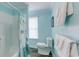 Clean bathroom with shower/tub combo, toilet, and window at 1418 S Ocean Blvd., North Myrtle Beach, SC 29582