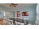 Dining area with a rustic wood table and white chairs at 1418 S Ocean Blvd., North Myrtle Beach, SC 29582