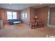 Finished basement with carpeted floors, comfy seating, and a wood-paneled bar at 230 Sea Oats Circle, Pawleys Island, SC 29585
