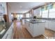Modern kitchen with white cabinets, granite countertops, and island at 230 Sea Oats Circle, Pawleys Island, SC 29585