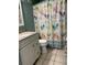 Bathroom with beach-themed shower curtain and vanity at 5905 S Kings Hwy. # 337B, Myrtle Beach, SC 29575