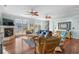 Open living room with hardwood floors, fireplace, and comfortable seating at 1010 Perrin Dr., North Myrtle Beach, SC 29582