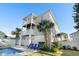 Backyard oasis with a pool, patio furniture, and palm trees at 1010 Perrin Dr., North Myrtle Beach, SC 29582