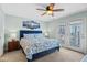 Main bedroom with a king-size bed and balcony access at 1010 Perrin Dr., North Myrtle Beach, SC 29582