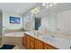 Bathroom with double vanity, a soaking tub, and a shower at 1010 Perrin Dr., North Myrtle Beach, SC 29582