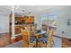 Charming dining area with glass table and wicker chairs, adjacent to kitchen at 1010 Perrin Dr., North Myrtle Beach, SC 29582