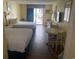 Two beds, small table, and balcony access at 1207 S Ocean Blvd. # 50512, Myrtle Beach, SC 29577