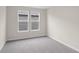 Simple bedroom with neutral walls and carpet at 1906 Woodrush Loop, Little River, SC 29566