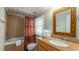 Clean bathroom with shower/tub combo, granite vanity, and mirror at 1906 S Ocean Blvd., North Myrtle Beach, SC 29582