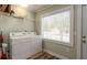 Convenient laundry room with side-by-side washer and dryer, and built-in shelving at 1906 S Ocean Blvd., North Myrtle Beach, SC 29582
