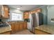 Well-equipped kitchen with light wood cabinets, granite countertops, and stainless steel appliances at 1906 S Ocean Blvd., North Myrtle Beach, SC 29582