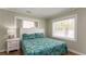 Bedroom with a full bed, nightstand, and leafy bedding at 1906 S Ocean Blvd., North Myrtle Beach, SC 29582
