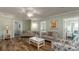Bright living room with hardwood floors, comfy seating, and views into other rooms at 1906 S Ocean Blvd., North Myrtle Beach, SC 29582