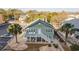 Charming two-story home with a deck and surrounding trees at 1906 S Ocean Blvd., North Myrtle Beach, SC 29582