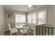 Bright dining area with glass table and four white chairs at 1906 S Ocean Blvd., North Myrtle Beach, SC 29582