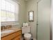 Small bathroom with toilet, sink, and shower at 1906 S Ocean Blvd., North Myrtle Beach, SC 29582