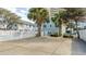 Inviting pool area with a white fence and ample concrete space at 1906 S Ocean Blvd., North Myrtle Beach, SC 29582