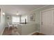 Small dining area with glass top table and four chairs, near entryway at 1906 S Ocean Blvd., North Myrtle Beach, SC 29582