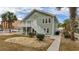 Two-story house with a green exterior, deck, and landscaping at 1906 S Ocean Blvd., North Myrtle Beach, SC 29582