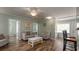 Open living room featuring hardwood floors, neutral color palette, and access to other areas at 1906 S Ocean Blvd., North Myrtle Beach, SC 29582