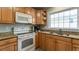 Kitchen boasts ample cabinetry, granite countertops, and a full suite of appliances at 1906 S Ocean Blvd., North Myrtle Beach, SC 29582