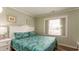 Bedroom with a full bed, nightstand and leafy bedding at 1906 S Ocean Blvd., North Myrtle Beach, SC 29582