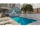Shared pool area with ample lounge chairs and a hot tub nearby at 1906 S Ocean Blvd., North Myrtle Beach, SC 29582