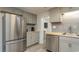 Updated kitchen with stainless steel appliances and gray cabinets at 510 Hillside Dr. S, North Myrtle Beach, SC 29582